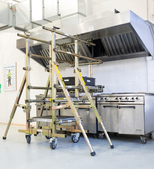 Training academy interior with tools and kitchen fire