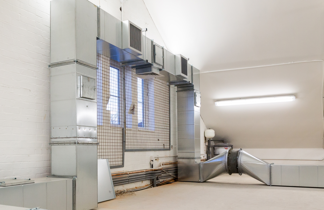 Training academy interior with ducts
