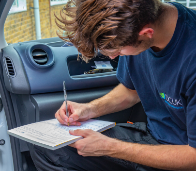 Technician taking notes